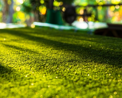 Artificial turf with sunlight,Grass field blur